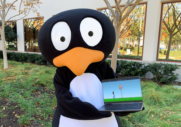 JiJi in mascot costume holds a Chromebook with new ST Math